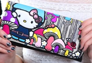 Hello Kitty fold over wallet with mushrooms on it